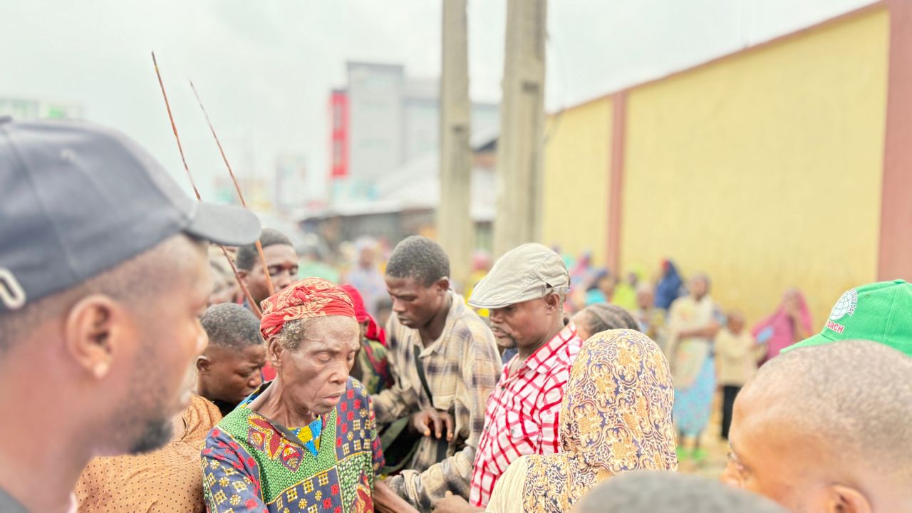 Foundation members interacting with community members outdoors