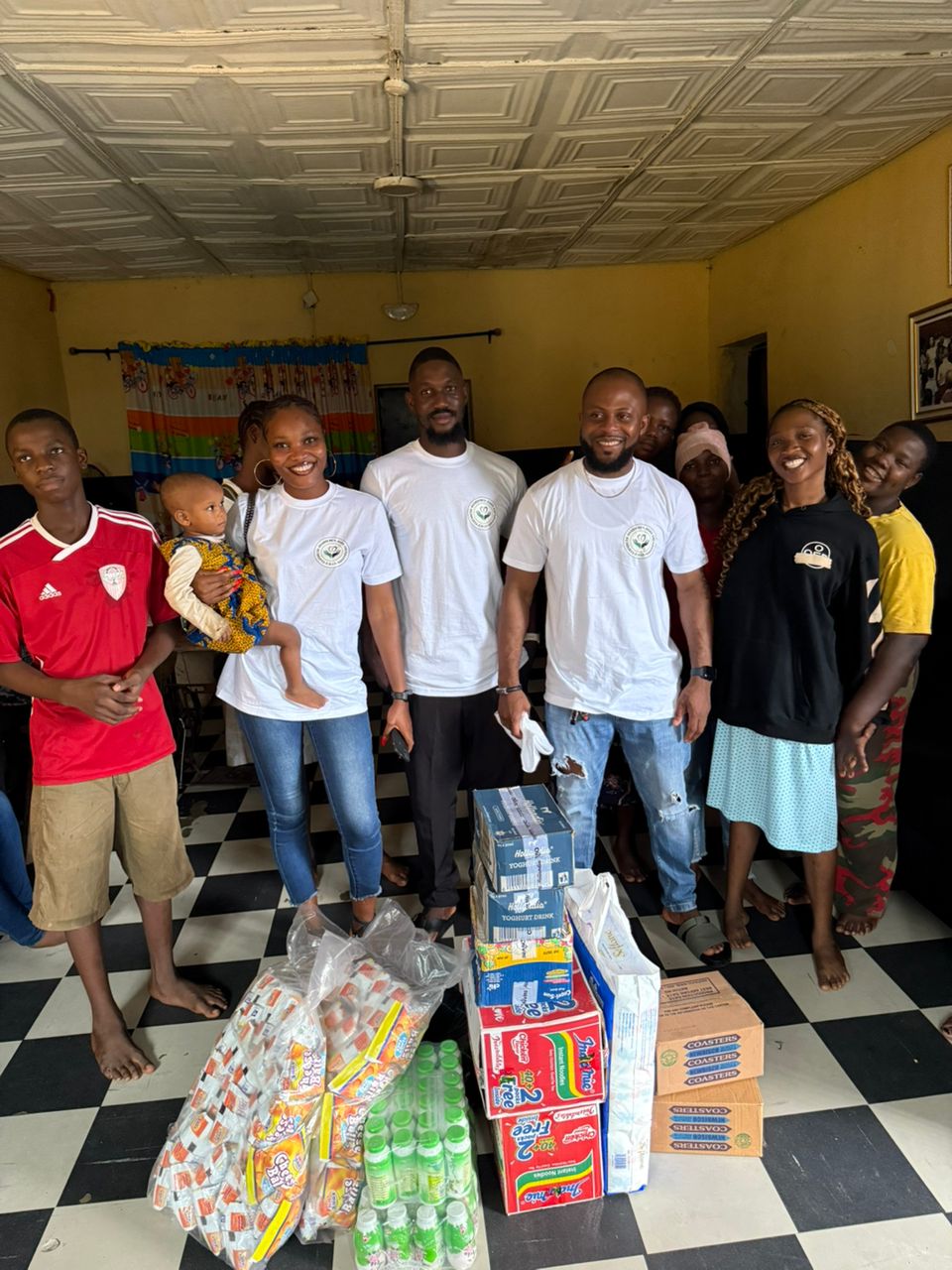 Volunteers working together in a community - ELIZABETH OSARIEMEN JOHN FOUNDATION volunteer with us page showcasing community impact and development work